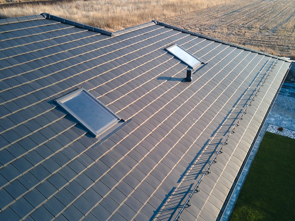 Closeup Of Attic Windows On House Roof Top Covered With Ceramic Expert Roofers